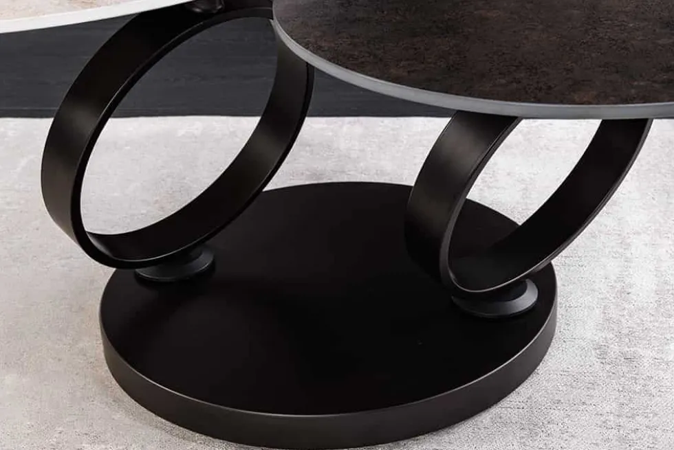 Design Couchtisch DANCING RINGS rost rund drehbar Travertin Keramik schwarz Gestell