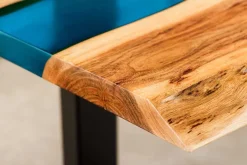 Massiver Couchtisch LIQUID 110cm braun Akazienholz Baumkante schwarz Eisen blau