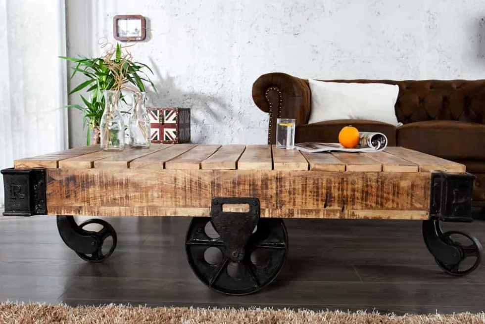 Massiver Design Couchtisch RAILWAY 110cm Mangoholz mit 4 Rädern